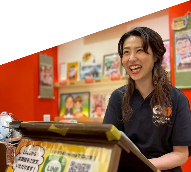 店舗でライブカリカチュアを行うアーティスト
